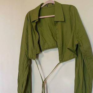 Green crop top with drawstrings that tie around your waist. I loved this shirt!